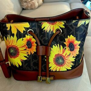 Calvin Klein, sunflower pocketbook and like new condition hardly used